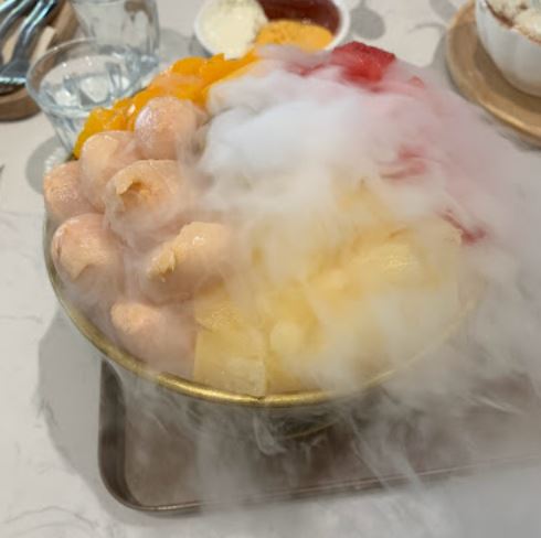 fruit dessert plate with smoky dry ice
